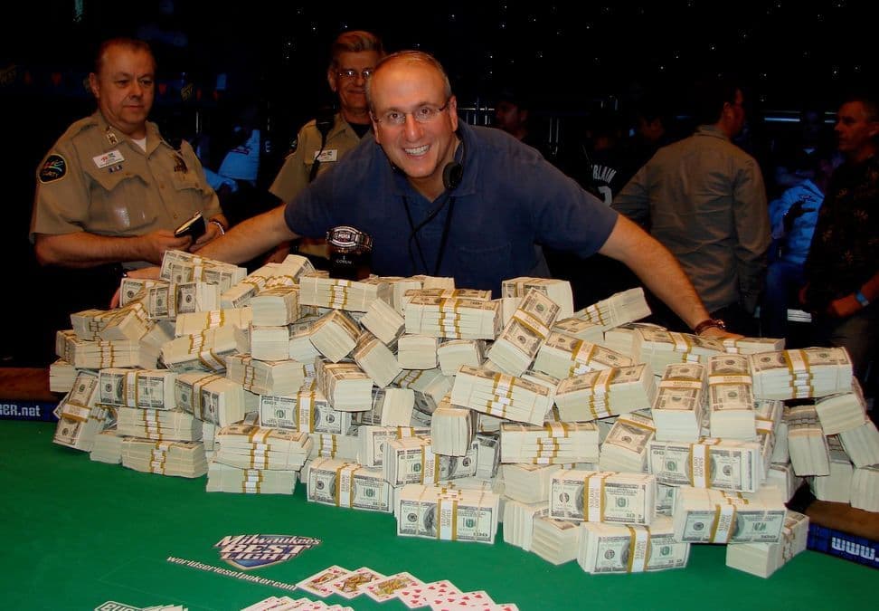 WSOP poker table surrounded by cameras and production crew