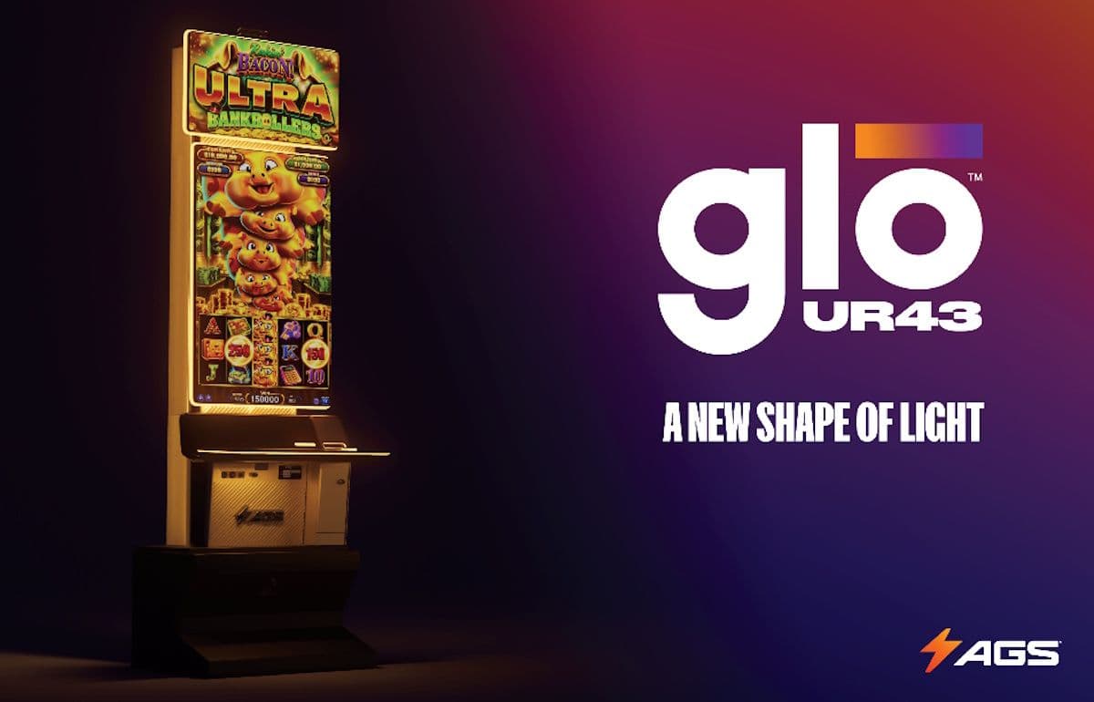 AGS Glō UR43 casino cabinet with 43-inch portrait display and lit topper on a casino floor