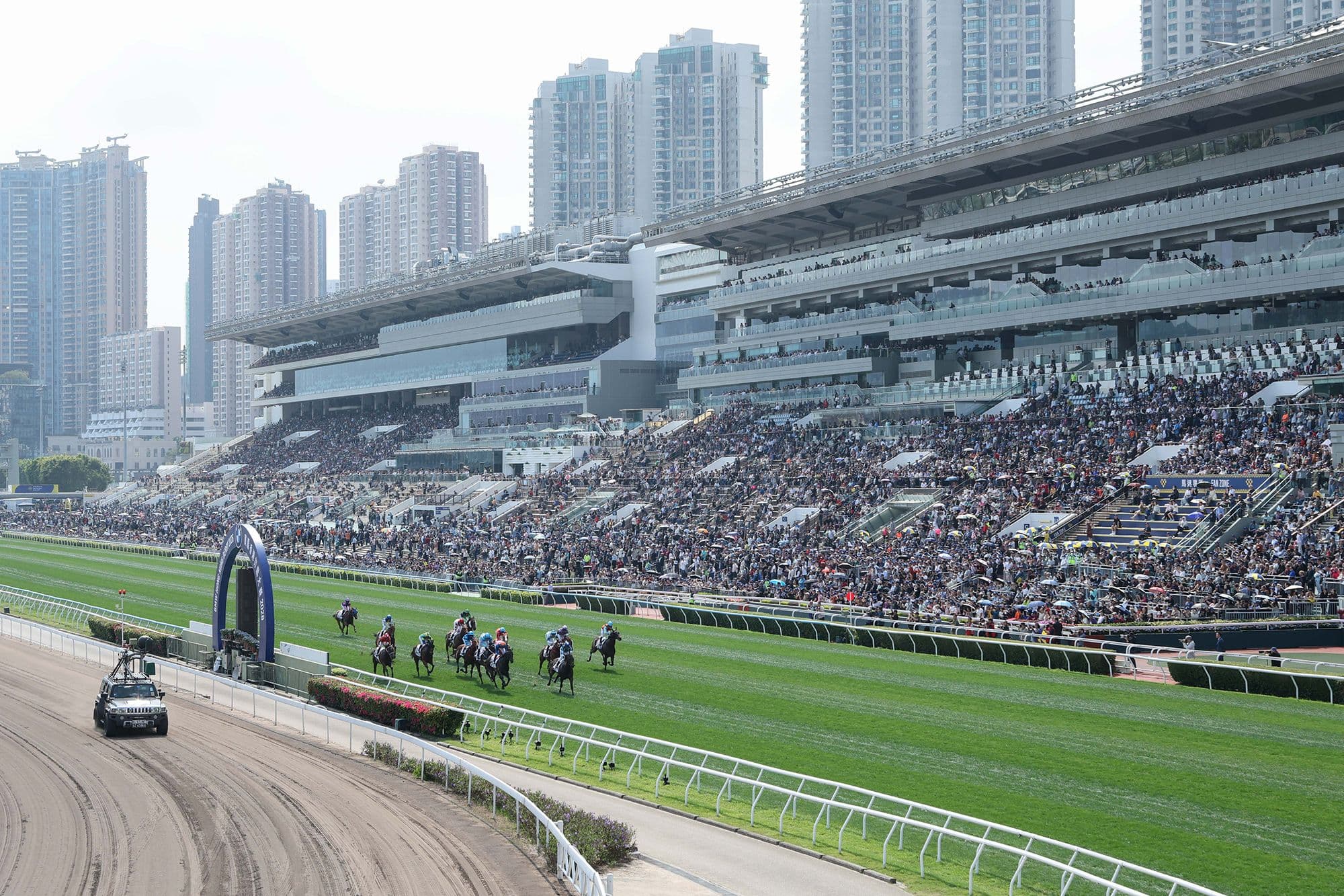Hong Kong Jockey Club headquarters with betting and lottery data displayed in Hong Kong
