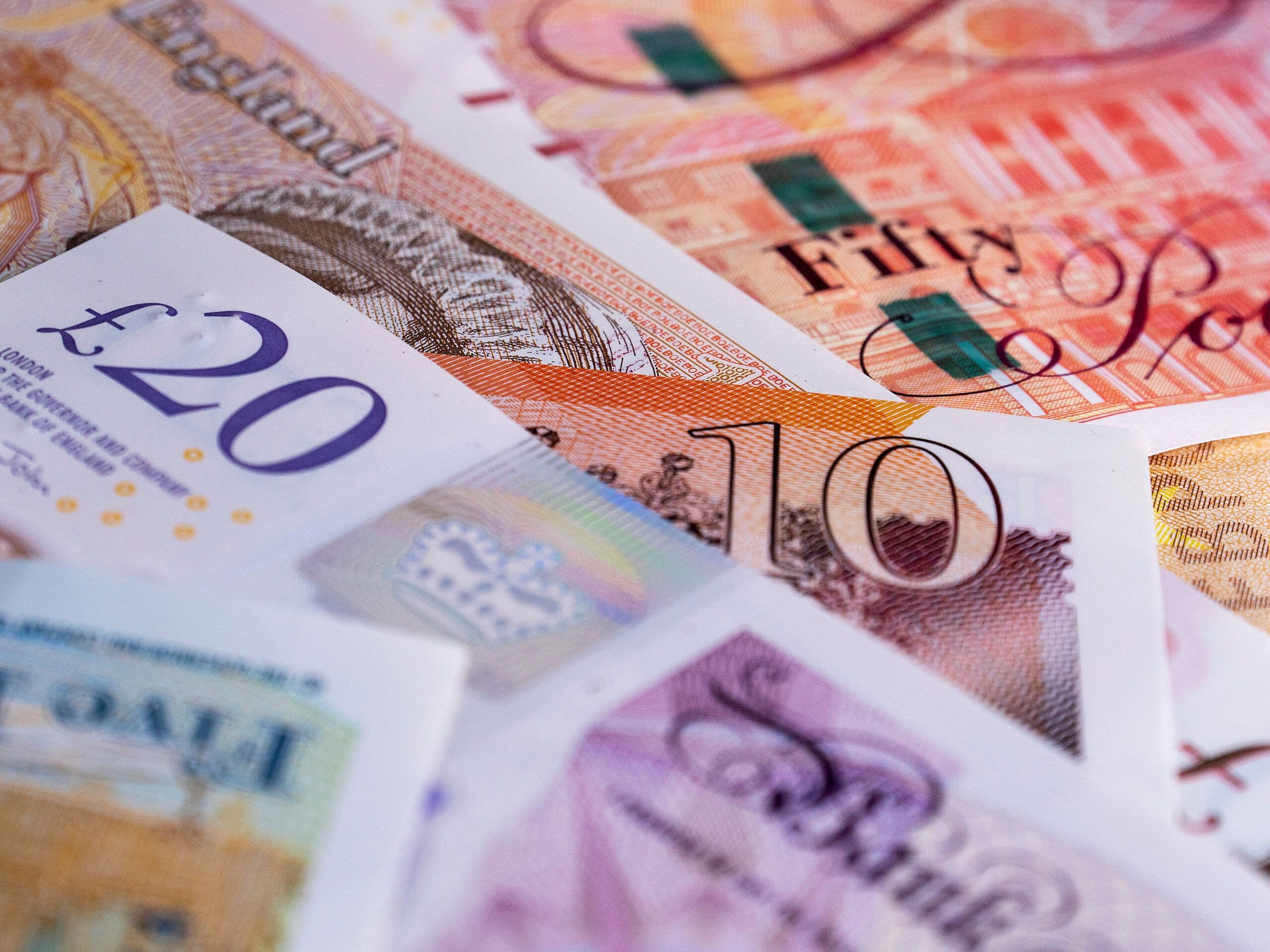 Gaming Realms logo over financial charts and a UK tax document reflecting H1 revenue performance in 2026