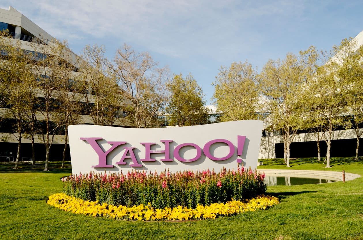 Yahoo Sports homepage shown alongside Better Collective and Action Network betting content overlays