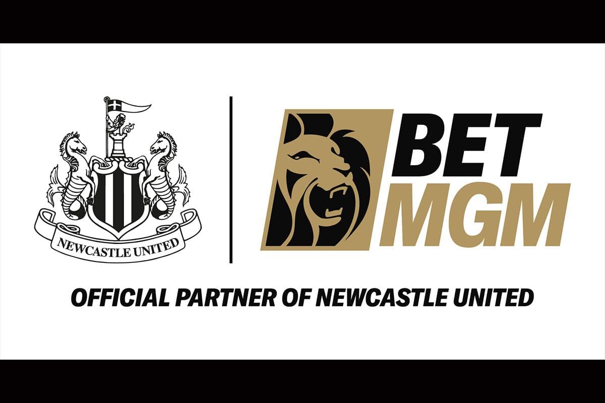 BetMGM branding at Newcastle United home match, LED signage with football fans in stadium stands
