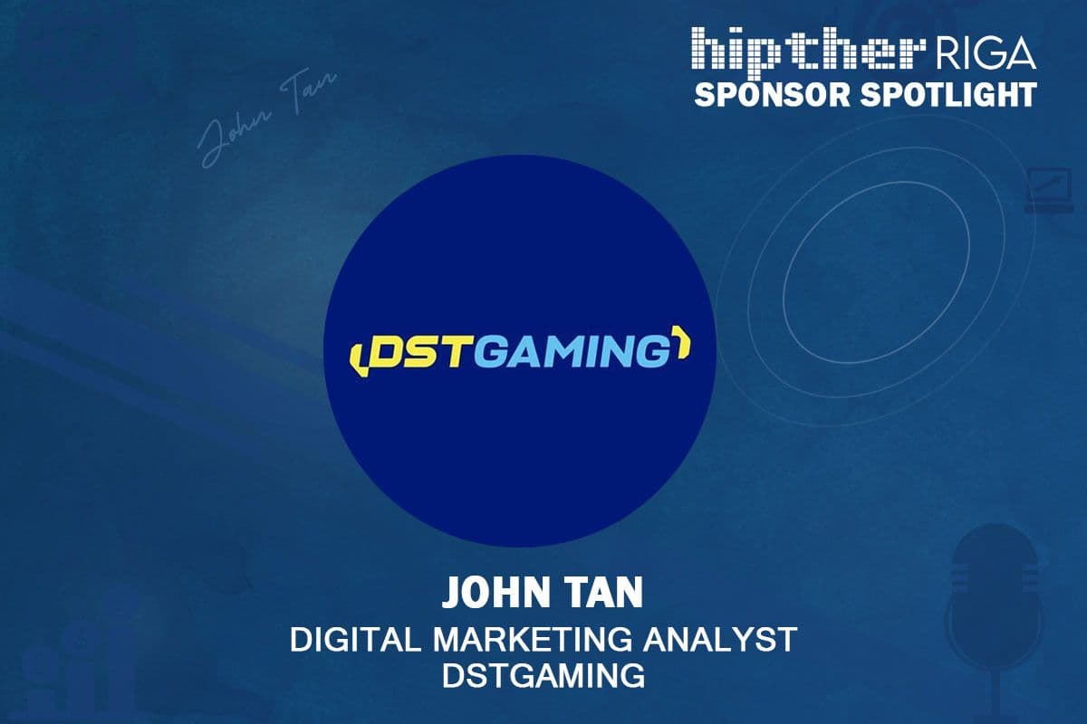 Entrevista empresarial en el evento comercial HIPTHER Baltics: Riga 2026, branding de DSTGAMING visible