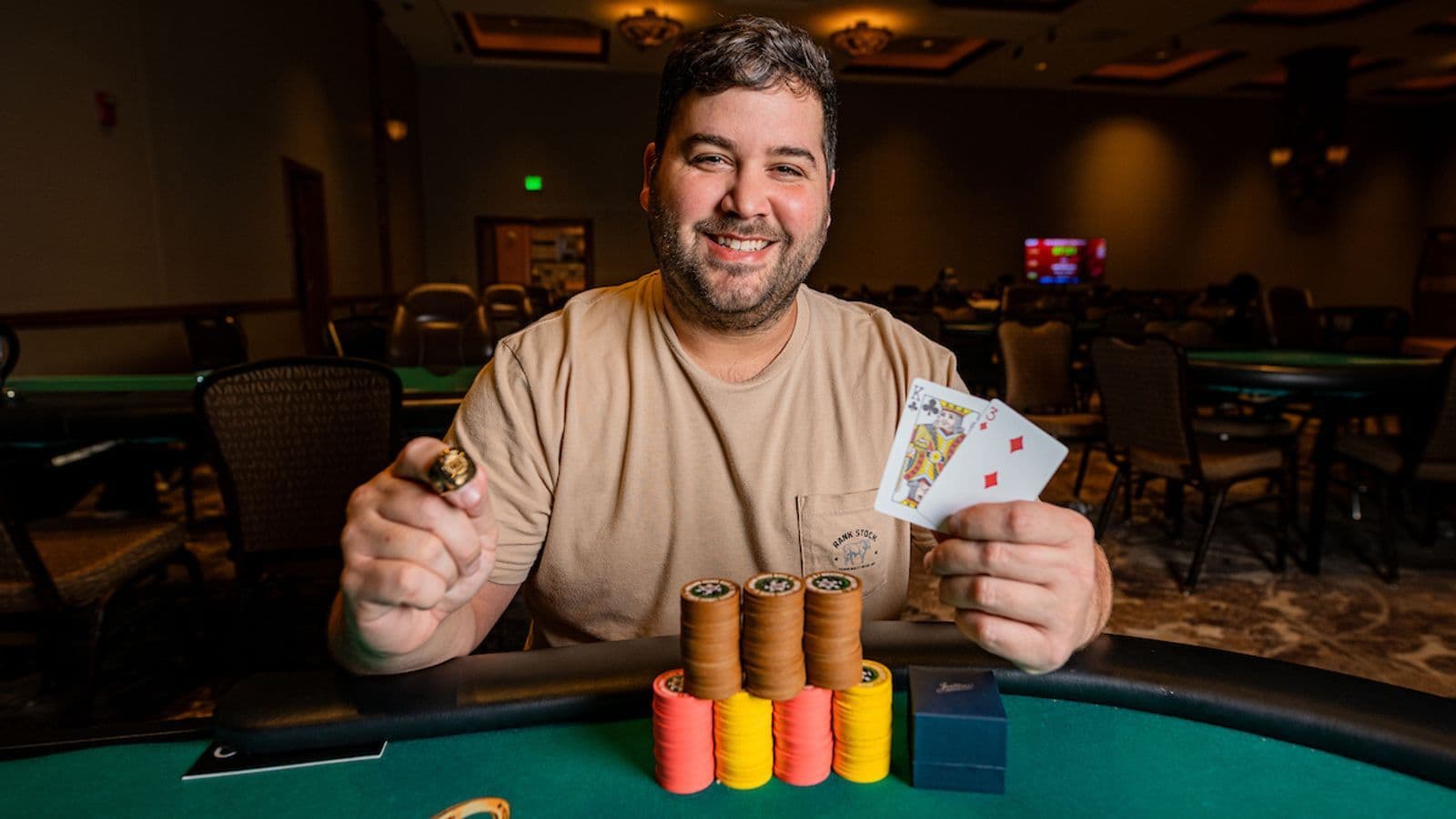 Connor Hayward celebrates his victory in the WSOP Circuit Main Event at Horseshoe Council Bluffs with the champion ring.