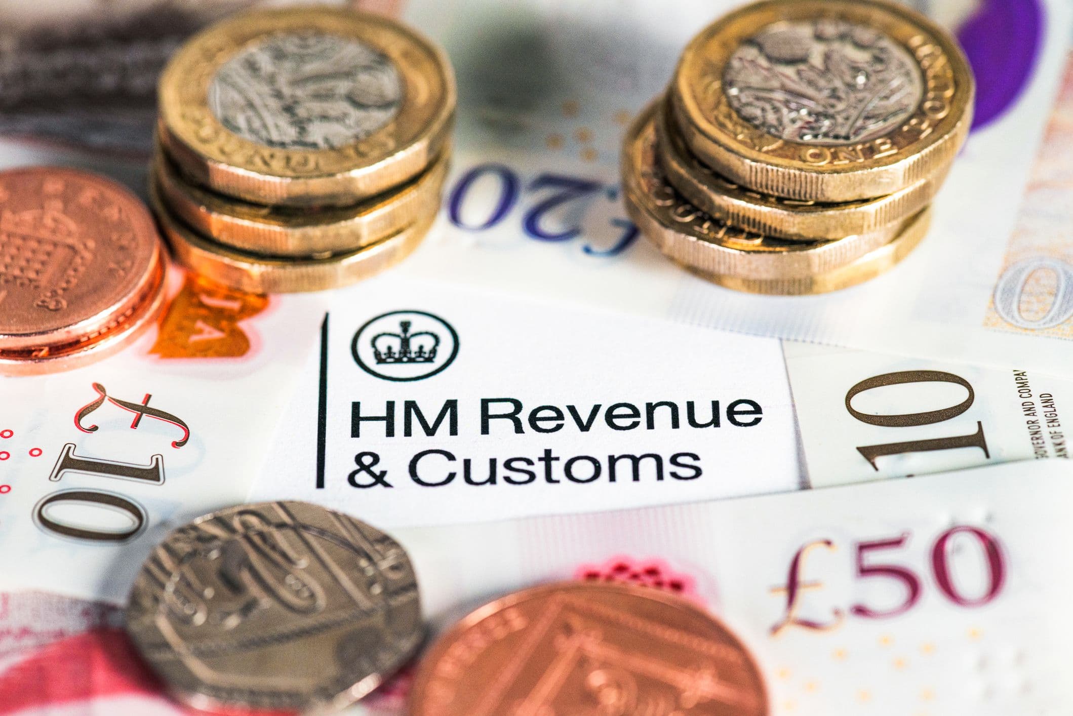 Court documents and remote gaming promotional free spins highlighted with a gavel and tax forms