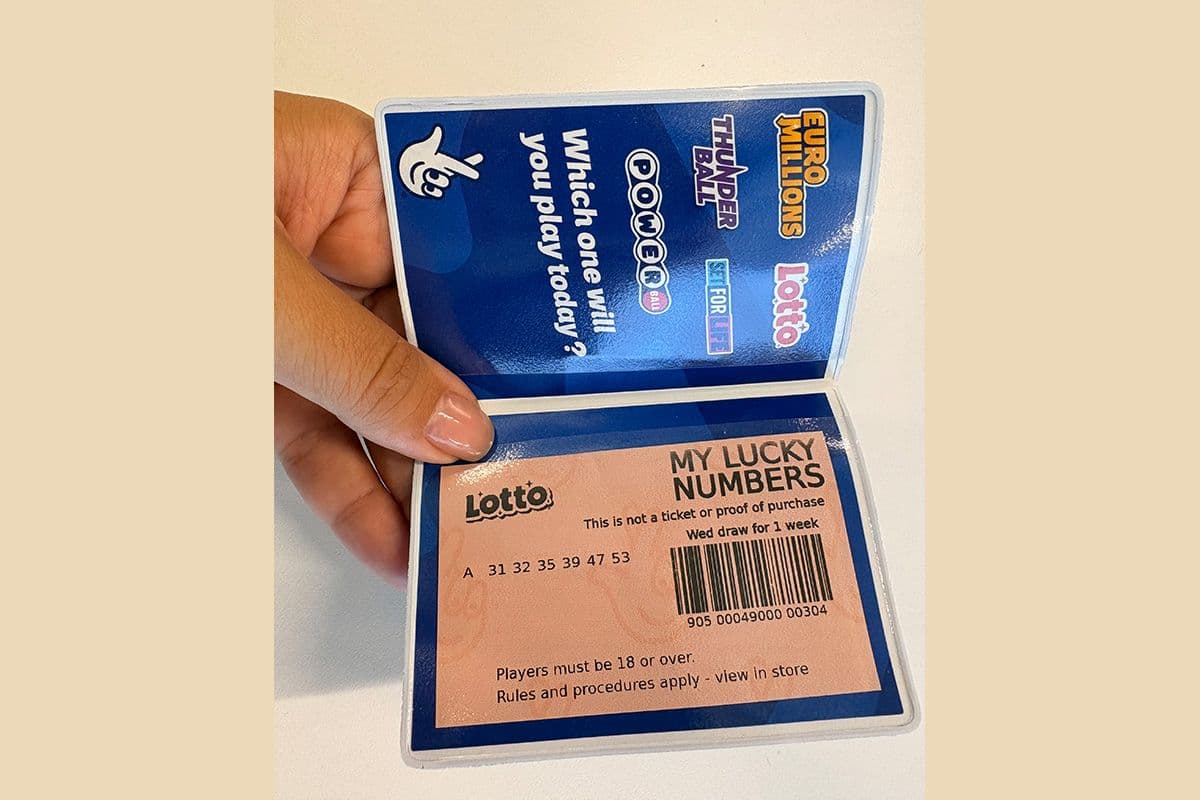 Limited edition FastPay wallets stacked next to a FastPay card and in-store terminal