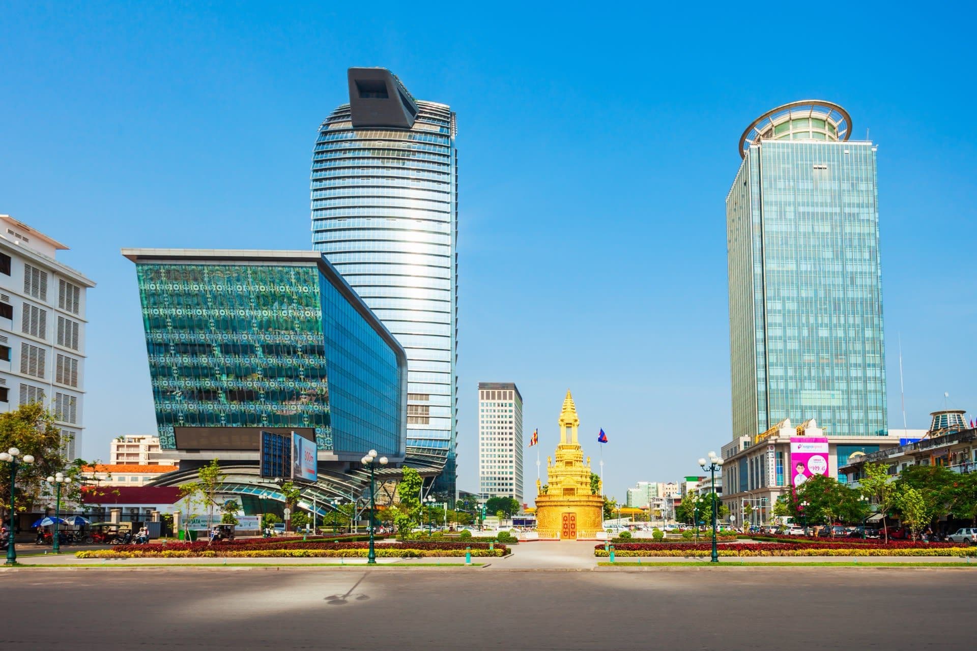 Cambodian casino exterior with enforcement officers and removed broadcast equipment in crates