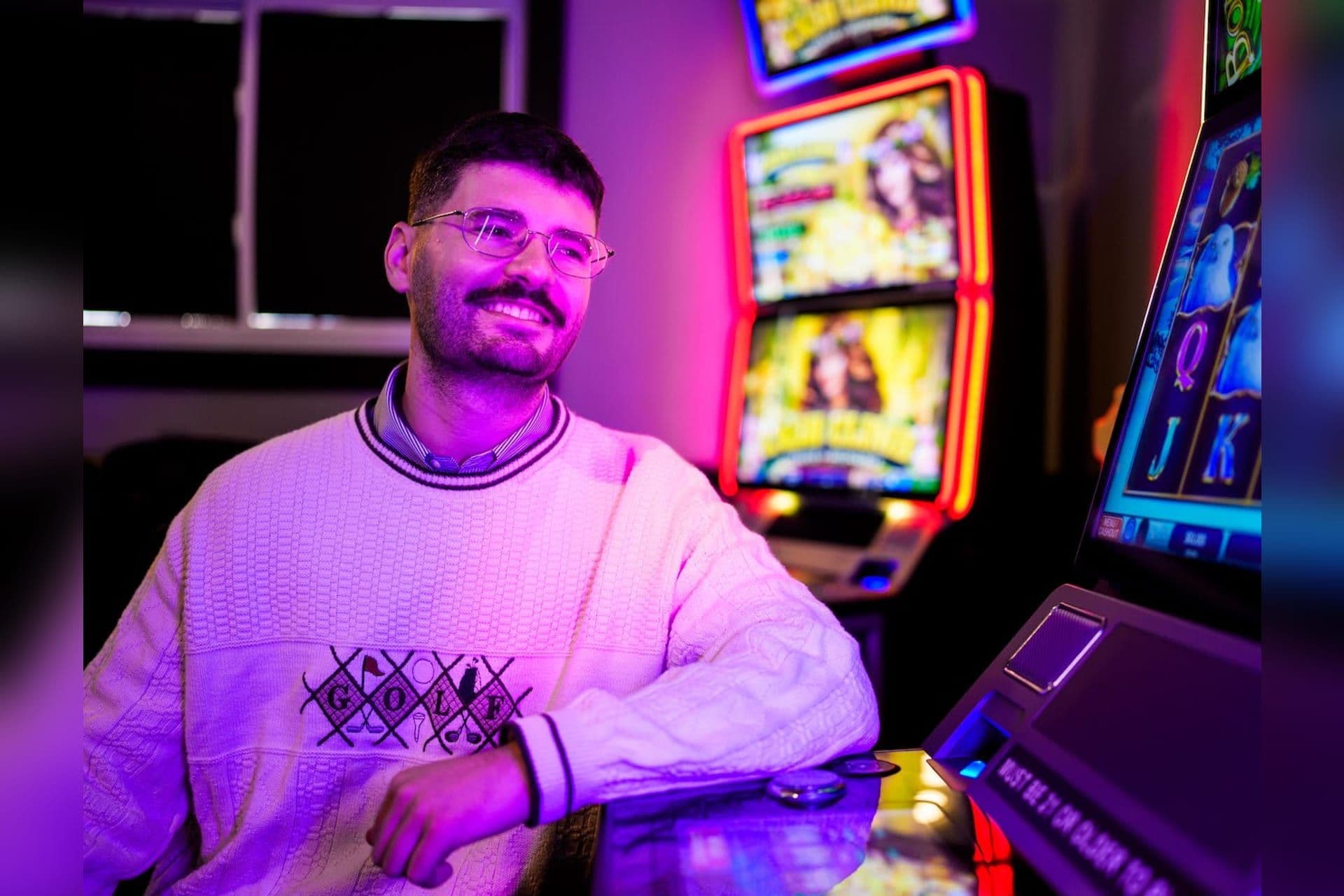 Researcher analysing statewide iGaming transaction feeds and slot terminal revenue on a laptop