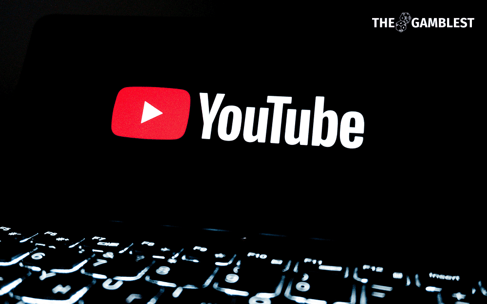YouTube Masthead slot showing a gambling advertisement with compliance documentation overlay