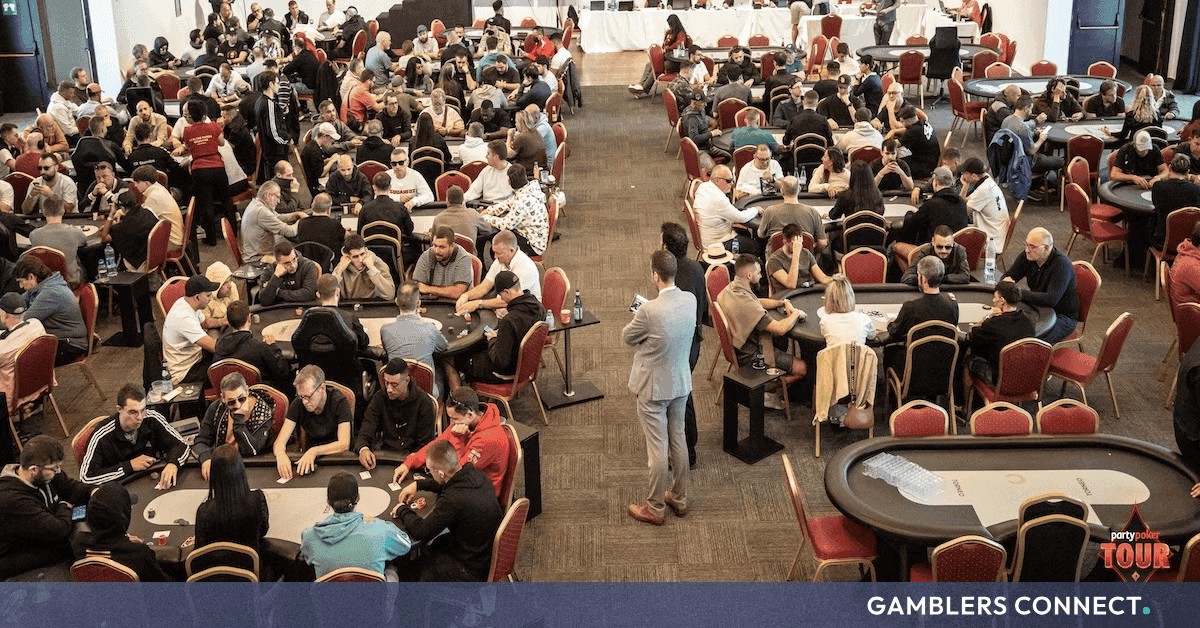 PartyPoker Tour Castellón tournament floor with players, chips and event signage at Orenes Gran Casino Castellón