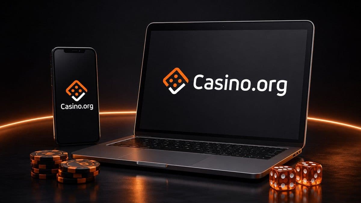 Stacked casino chips and a smartphone showing an online casino lobby, representing Ontario’s regulated iGaming market