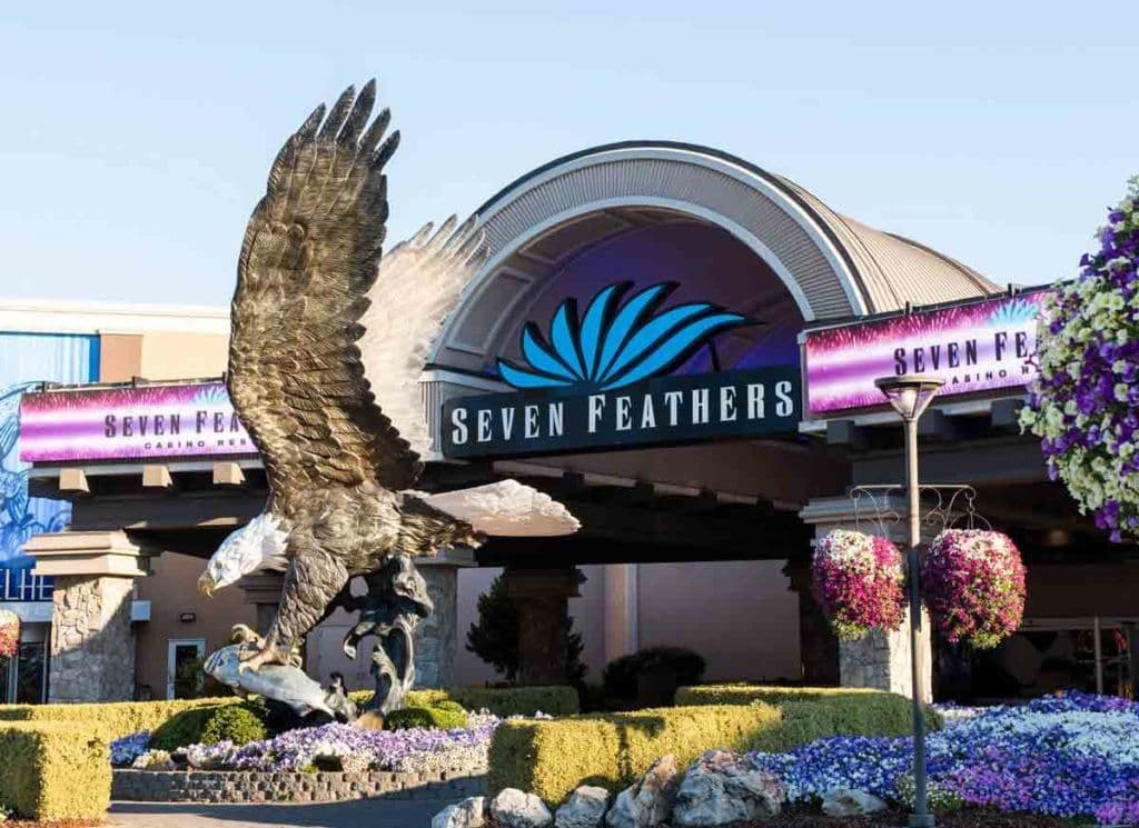Seven Feathers Casino Resort exterior with resort buildings and RV park, representing unified operations