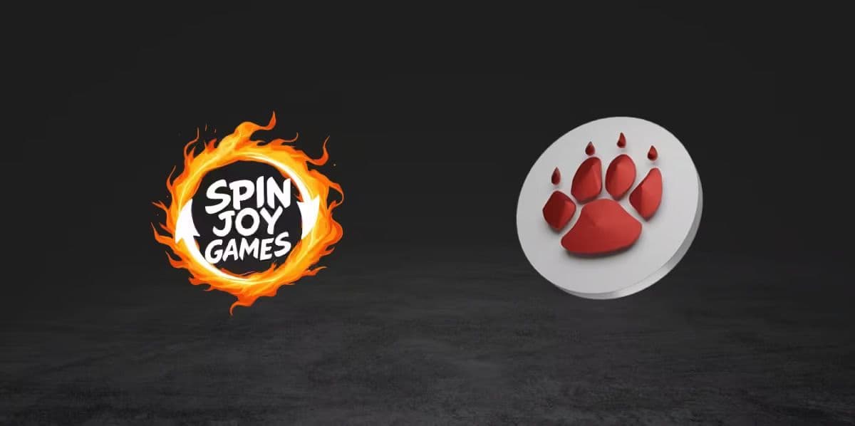 QTech and Spin Joy Games partnership illustration with slot and instant win icons