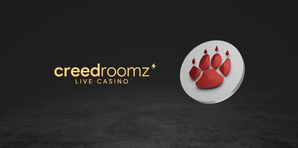 Studio shot of a live-dealer table with dealer and studio lights, representing CreedRoomz content on an aggregation platform