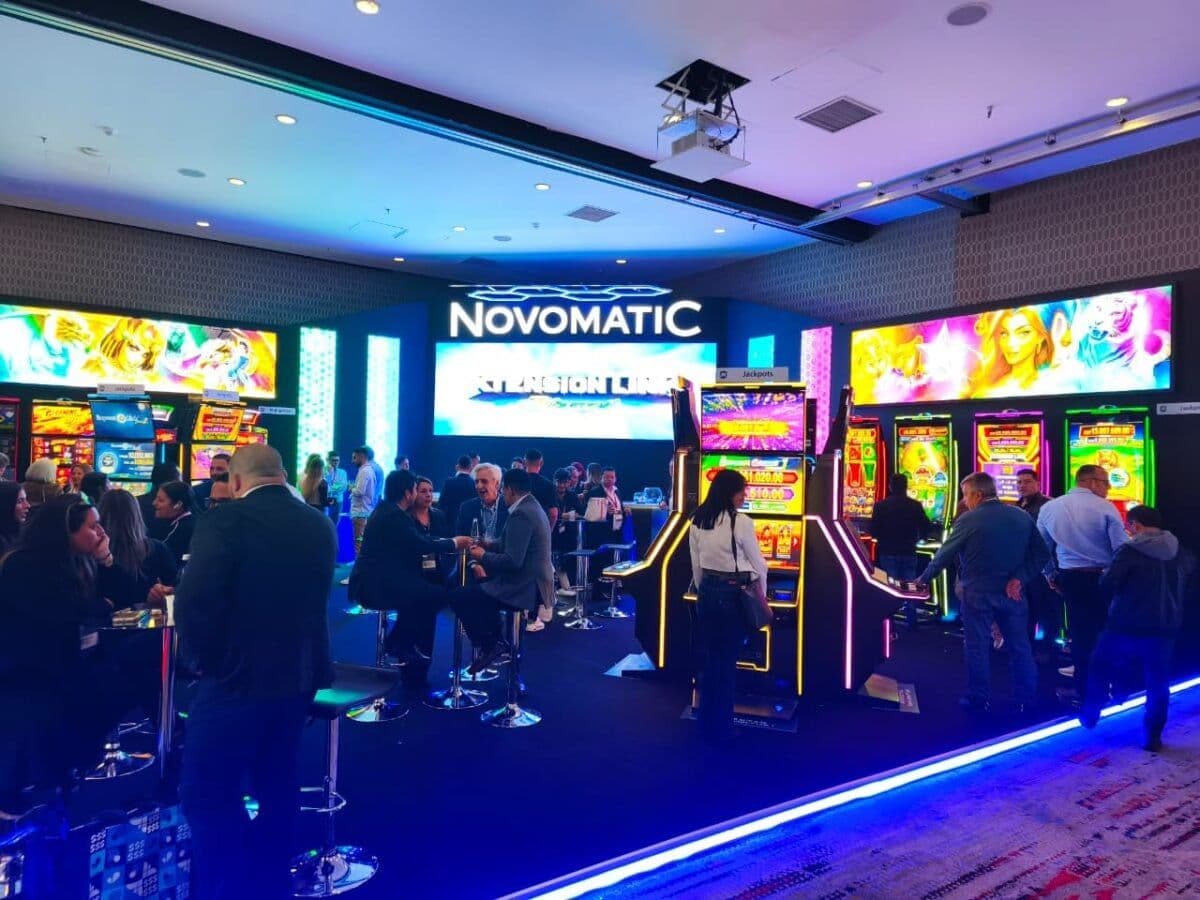 Novomatic Colombia team at Stand A15 during GAT Bogotá 2026 surrounded by cabinets and operators