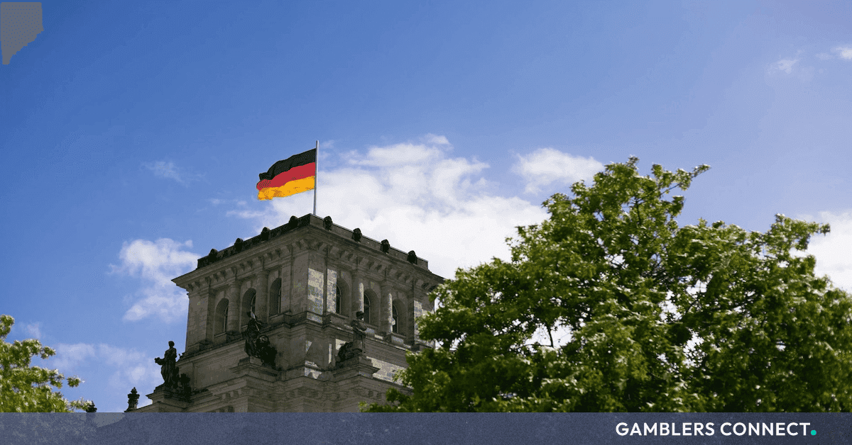 Files and documents from a tax investigation beside an online casino interface on a desk in Frankfurt